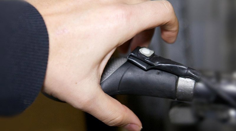 hand on e-bike push button throttle