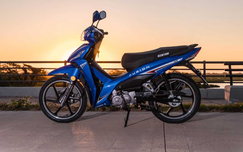 blue moped at sunset
